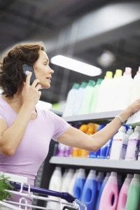 Woman on the phone in a grocery aisle.